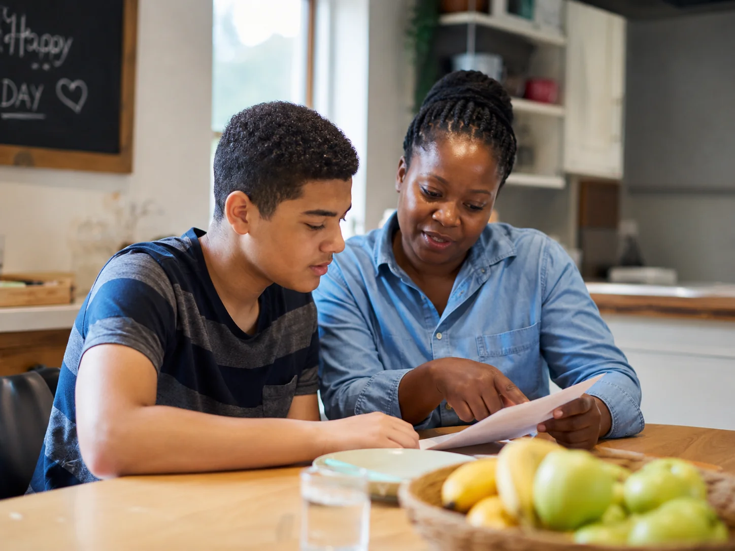 Support worker spending time with a child in a calm home setting